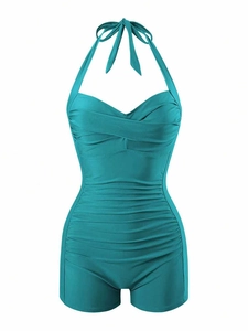 Teal one-piece swimsuit featuring retro halter neck and tummy control shirred fabric