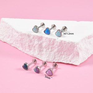 Detailed view of heart-shaped opal stud set in six vibrant colors with 16G steel post