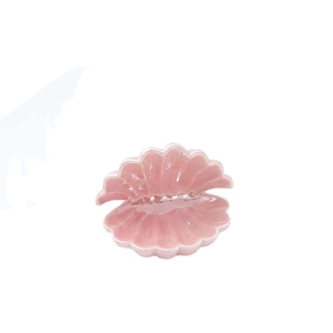 Pink ceramic shell-shaped jewelry tray with a glossy finish for home storage