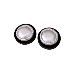 Retro round stud earrings featuring white pearl center with black velvet texture border