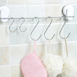 Wall-mounted stainless steel S-hook storage rack with white suction cup bases