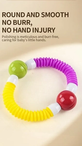 Close-up of flexible baby sensory ring with colorful telescopic tubes and smooth connectors