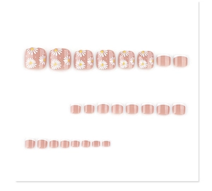 Detail of pink press-on toenails with white daisy patterns and French tips design