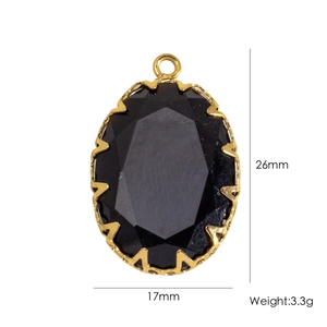 Macro detail of oval black faceted stone pendant with gold gear edge and dimensions