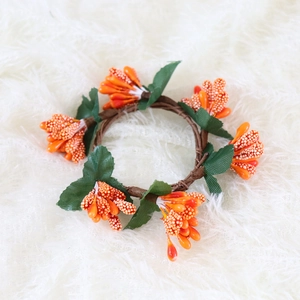 Orange faux berry and green leaf wreath for Halloween and Thanksgiving table decor
