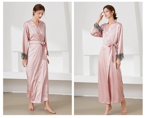 Detailed view of pink satin robe with delicate grey lace cuffs and waist tie closure