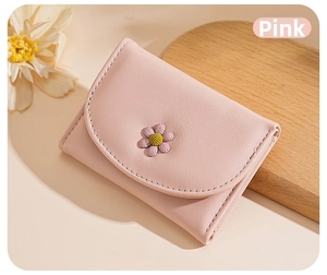Detail view of pink PU leather wallet featuring a 3D daisy flower and multiple slots