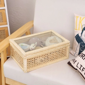 Handwoven rattan storage basket with clear glass lid for home organization and decor