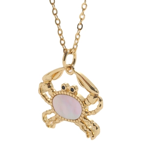 Golden crab pendant necklace with mother of pearl and zircon stones on white background