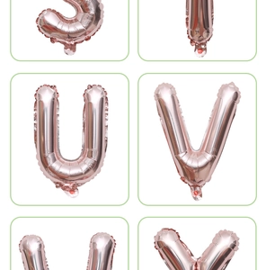 Detail of rose gold foil letter balloons U and V with metallic finish for party decor