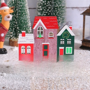 Christmas wooden house desktop ornament with Home for the Holidays text in festive scene
