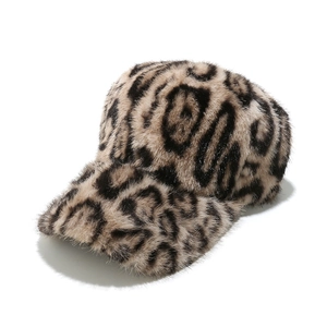 Close-up of fluffy faux mink fur texture on a leopard print baseball cap for winter
