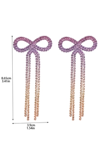 Detailed view of rhinestone bow earrings with purple-orange gradient tassels and size specs