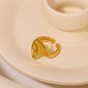 Irregular twisted wave 18K gold plated stainless steel open ring on ceramic tray