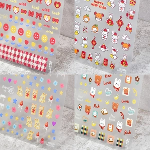 Macro detail of 5D embossed rabbit and floral nail art stickers with matte texture