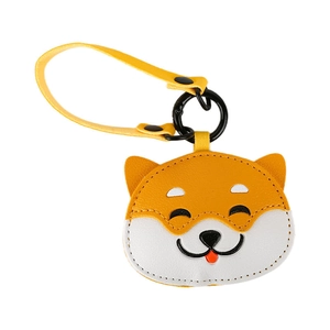 Cute Shiba Inu leather keychain with yellow strap and black spring hook on white background