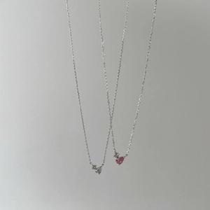 Detail of S925 sterling silver necklaces with pink and clear heart shaped zircon pendants