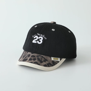 Detail of child's baseball cap with leopard print brim and 3D Number 23 embroidery