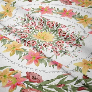 Close-up of bohemian floral tapestry fabric with lily print and soft texture