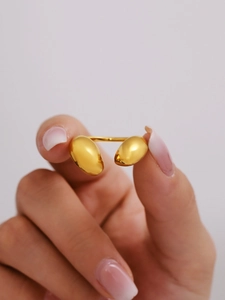 Detailed close-up of a 18K gold-plated stainless steel teardrop open ring on hand