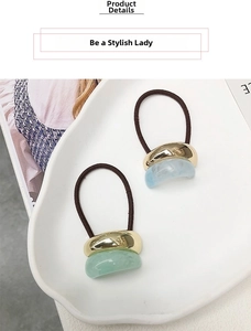 Set of two elastic hair ties with U-shaped gold metal and resin charms in light green and blue