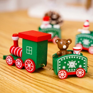 Macro shot of a wooden Christmas train featuring a small bear and snowflake patterns