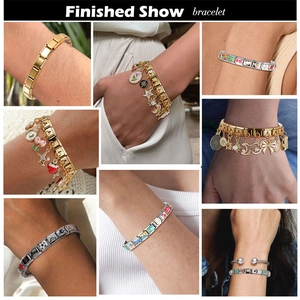 Detailed view of stackable Italian charm bracelets with gold and silver link charms