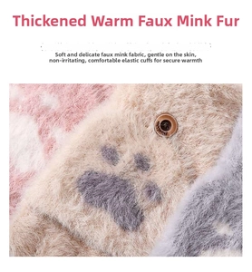 Macro detail of plush faux mink fabric with cat paw pattern and fashion button closure
