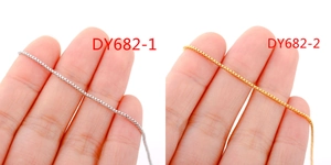 Close-up of 18k gold and silver stainless steel box chains for DIY jewelry making