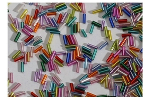 Close-up of multicolored silver-lined glass bugle beads for DIY jewelry making and sewing