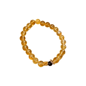 Elegant citrine beaded bracelet with garnet accent and golden flower charm accessory