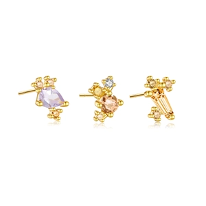 Three-piece gold stud earring set featuring purple, champagne, and yellow colored gemstones