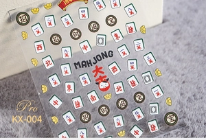Detail of 5D mahjong nail stickers featuring red, green and gold lucky characters