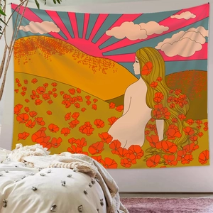 Detail of artistic bohemian wall tapestry featuring a colorful sunrise landscape over mountains