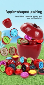 Red apple shaped matching toy set for kids on grass showing colorful interior shapes