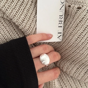 Minimalist 925 silver oval ring with matte brushed finish worn on hand for styling