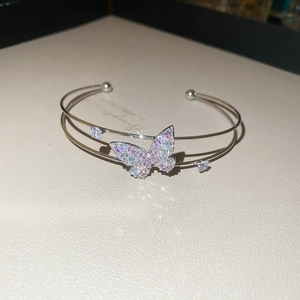 Detail of double-layer butterfly bangle with pink and white zircon stone inlay