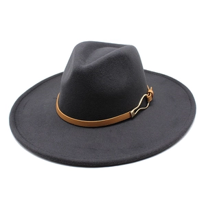 Detail of wide brim dark grey wool fedora hat with brown leather band and gold buckle