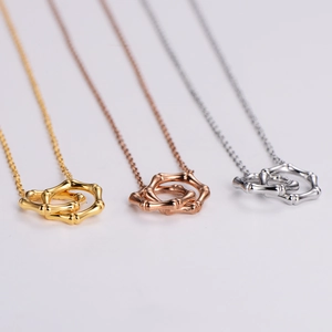 Minimalist bamboo node interlocking ring necklaces in gold, rose gold and silver finishes