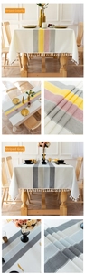 Close-up of waterproof striped linen tablecloth fabric with elegant white fringe edges