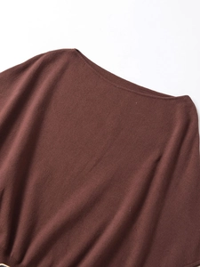 Detail showing the ribbed texture and wide boat neck of this dark brown knit top