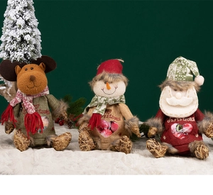 Detailed view of Christmas candy bags featuring snowman and reindeer plush decorations