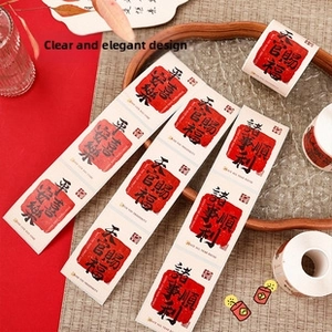 Detail of traditional Chinese New Year stickers with red festive text and blessing patterns