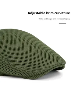 Detail of olive green mesh newsboy cap with flexible brim and breathable fabric
