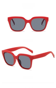 Front and side views of large square red sunglasses with grey lenses and matte finish