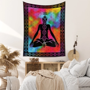 Detail of bohemian chakra tapestry featuring meditation silhouette against a galaxy nebula