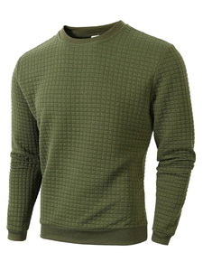 Detail of olive green long sleeve sweatshirt featuring unique quilted square texture