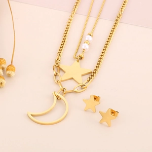 Detailed view of a gold-toned double-layered moon star necklace and stud earring set