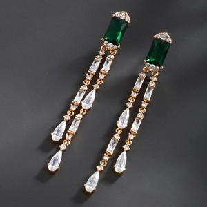 Detail of vintage emerald green crystal drop earrings with sparkling fringe design