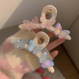 Gradiant butterfly hair claw clips with pastel pink and blue colors for elegant hairstyles
